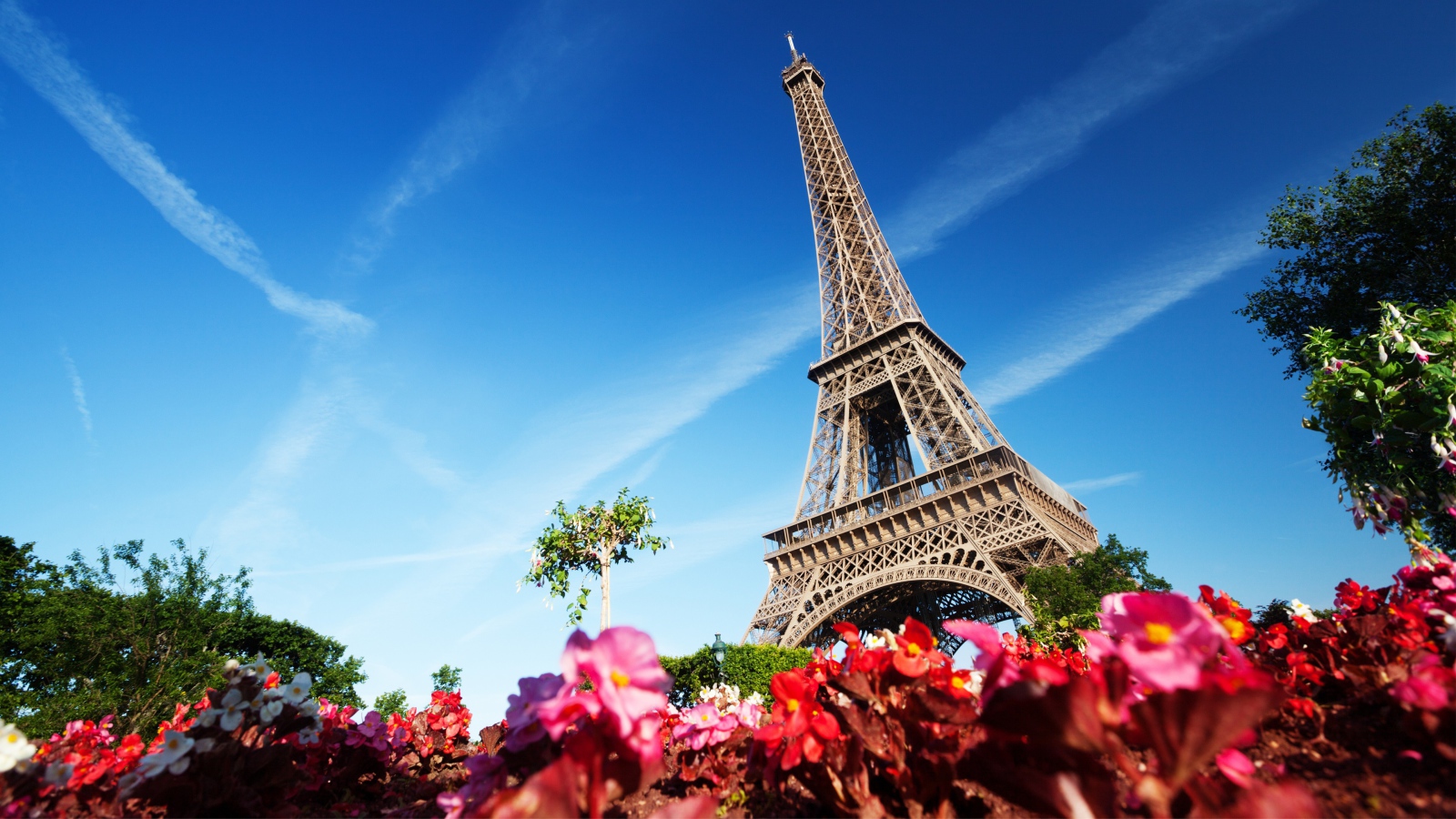 Eiffel tower on background of blue sky in Paris, France