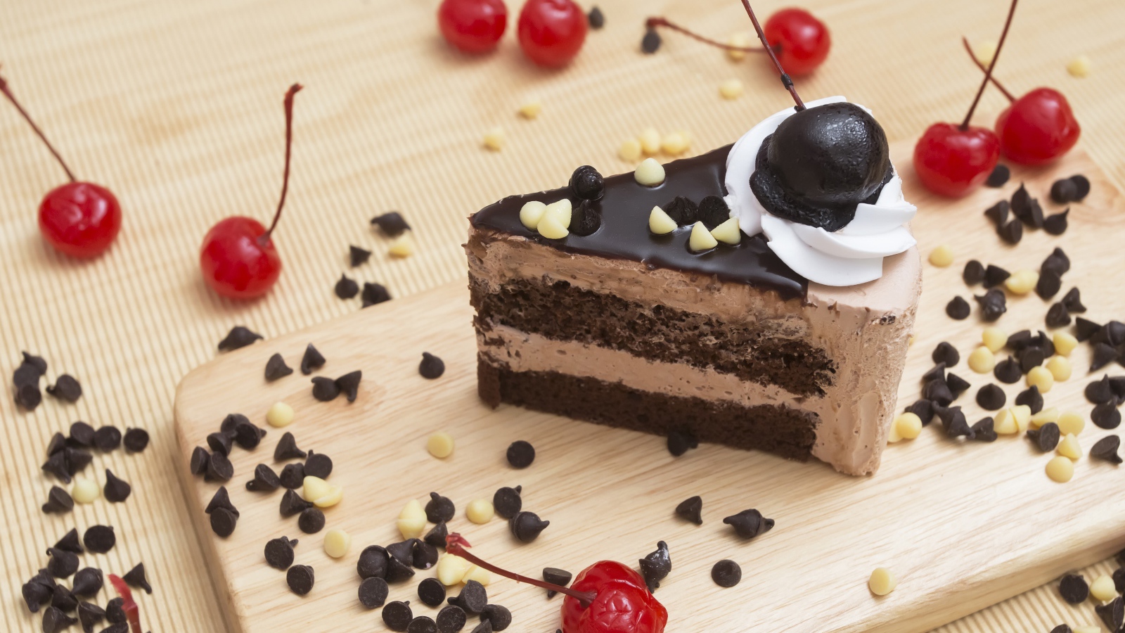 Appetizing piece of cake with chocolate and cherry berries