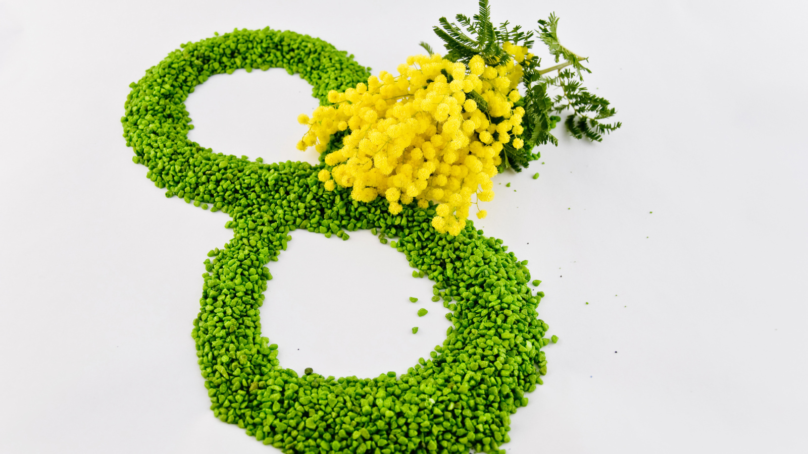 8 марта и ветка мимозы на сером фоне