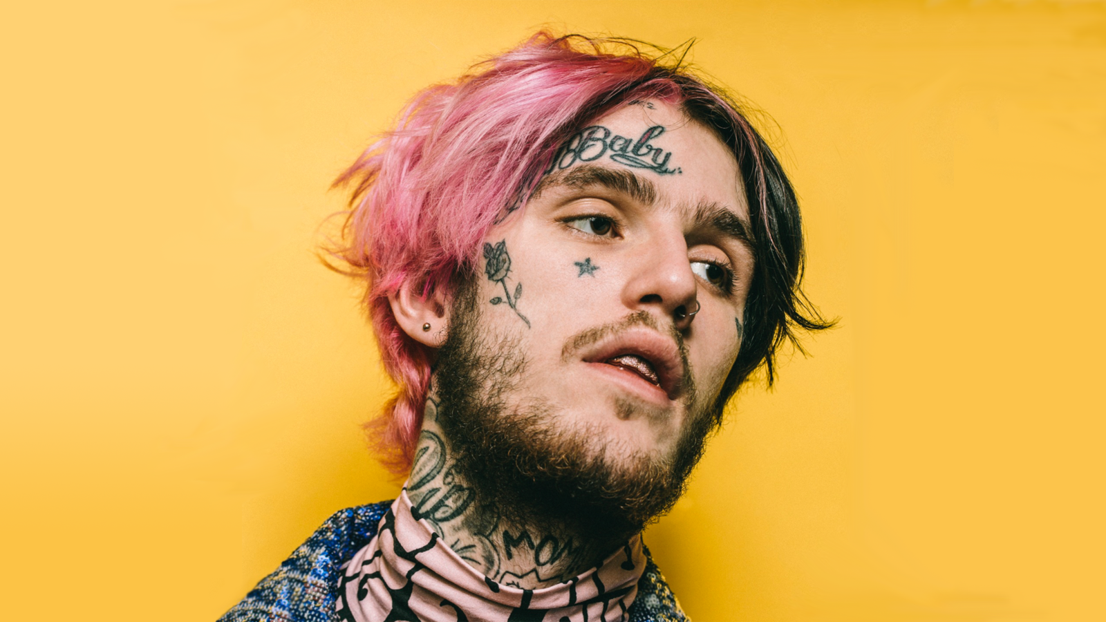 Американский рэпер Lil Peep с татуировками на лице