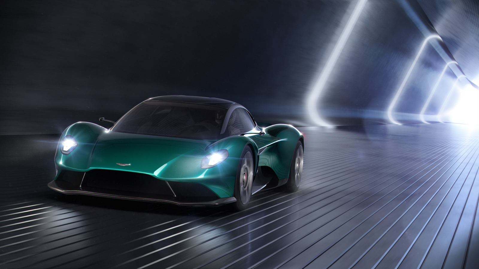 Зеленый спортивный автомобиль Aston Martin Vanquish Vision, 2019 года в тоннеле