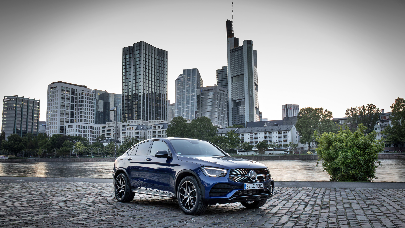 Blue car Mercedes-Benz GLC-Class on the background of skyscrapers