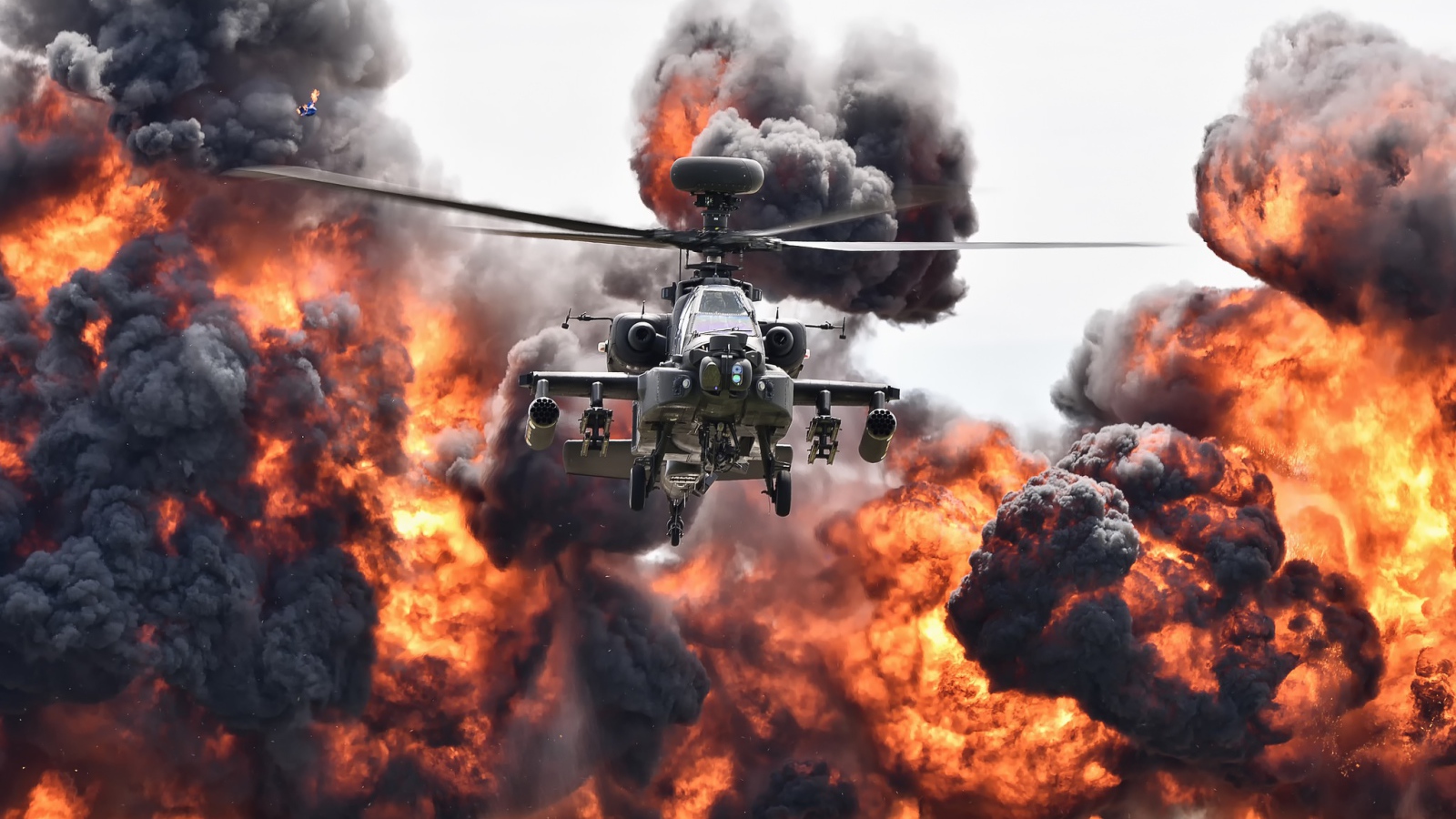Ударный вертолет армии США Boeing AH-64 Apache в клубе огня