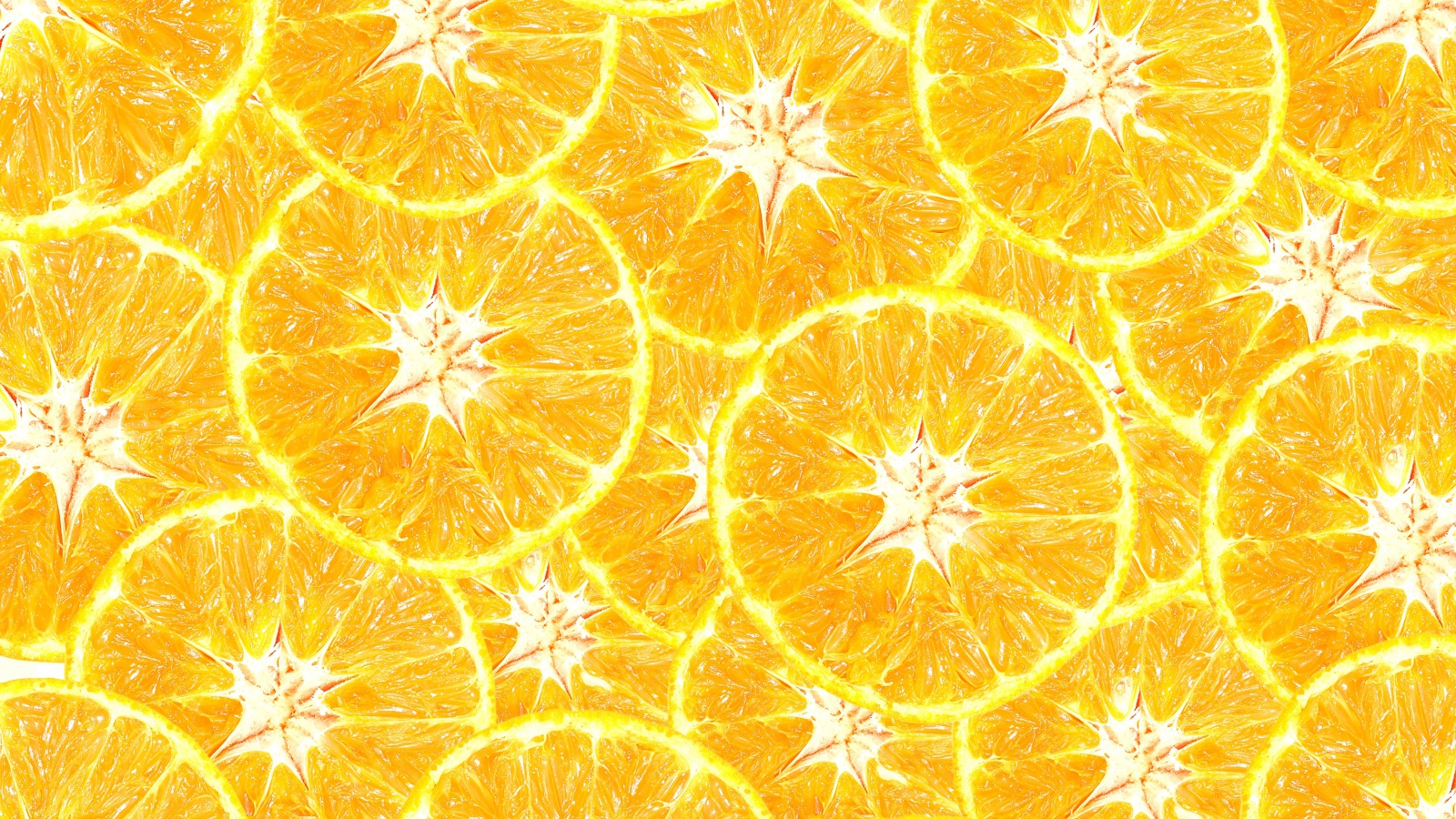 Оранжевый фон из кусочков апельсина крупным планом