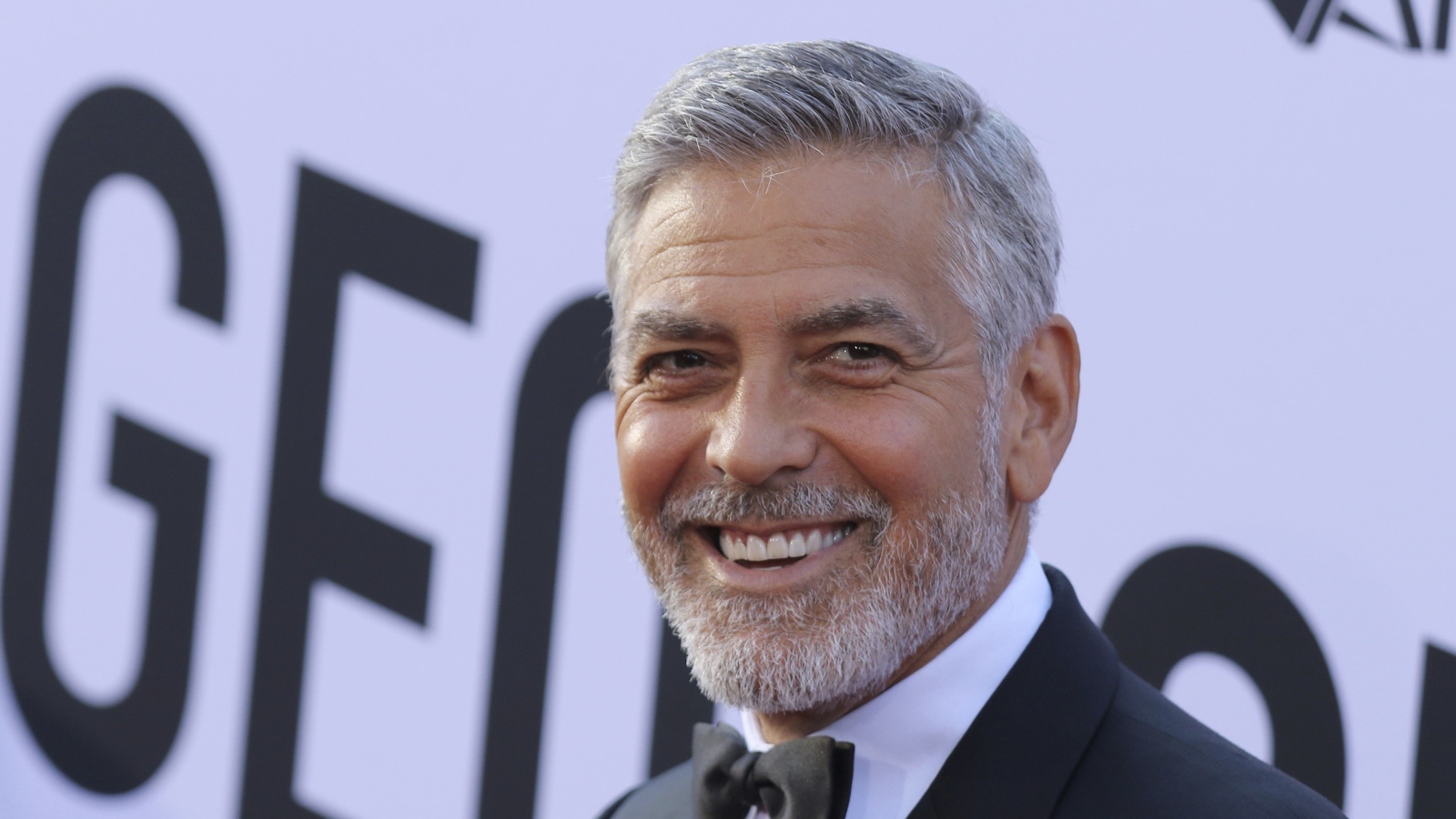 Smiling male actor George Clooney