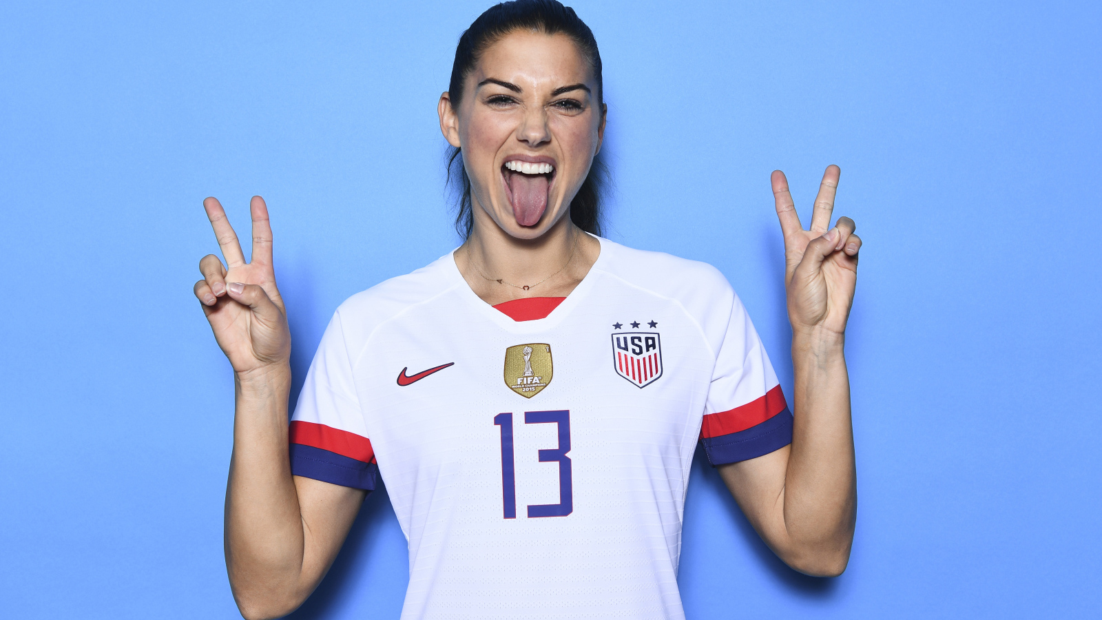 American footballer Alex Morgan with her tongue out