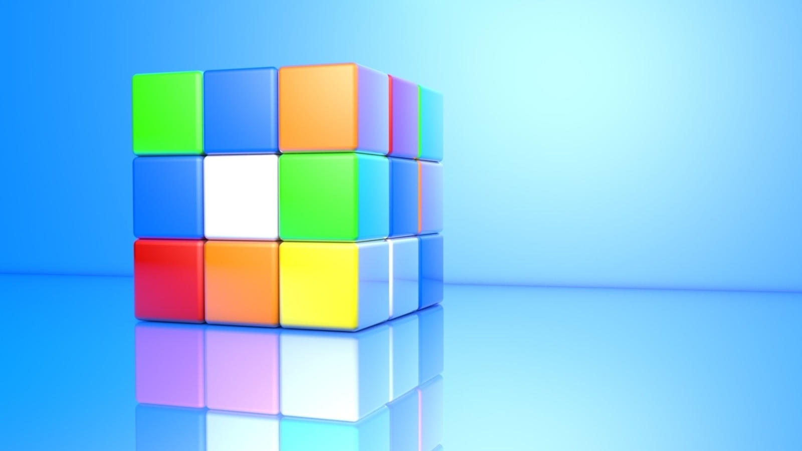 Разноцветный кубик Рубика на голубом фоне 3д графика