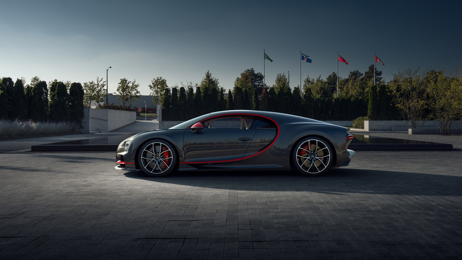 Серый автомобиль Bugatti Chiron CGI в парке