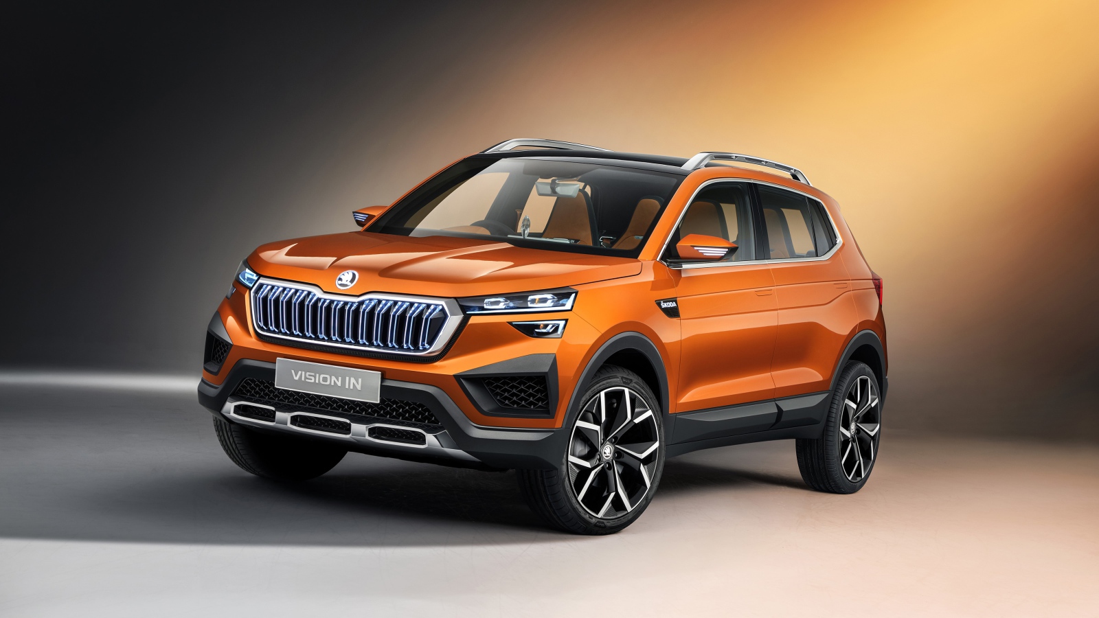 Оранжевый внедорожник Skoda Vision IN 2020 года