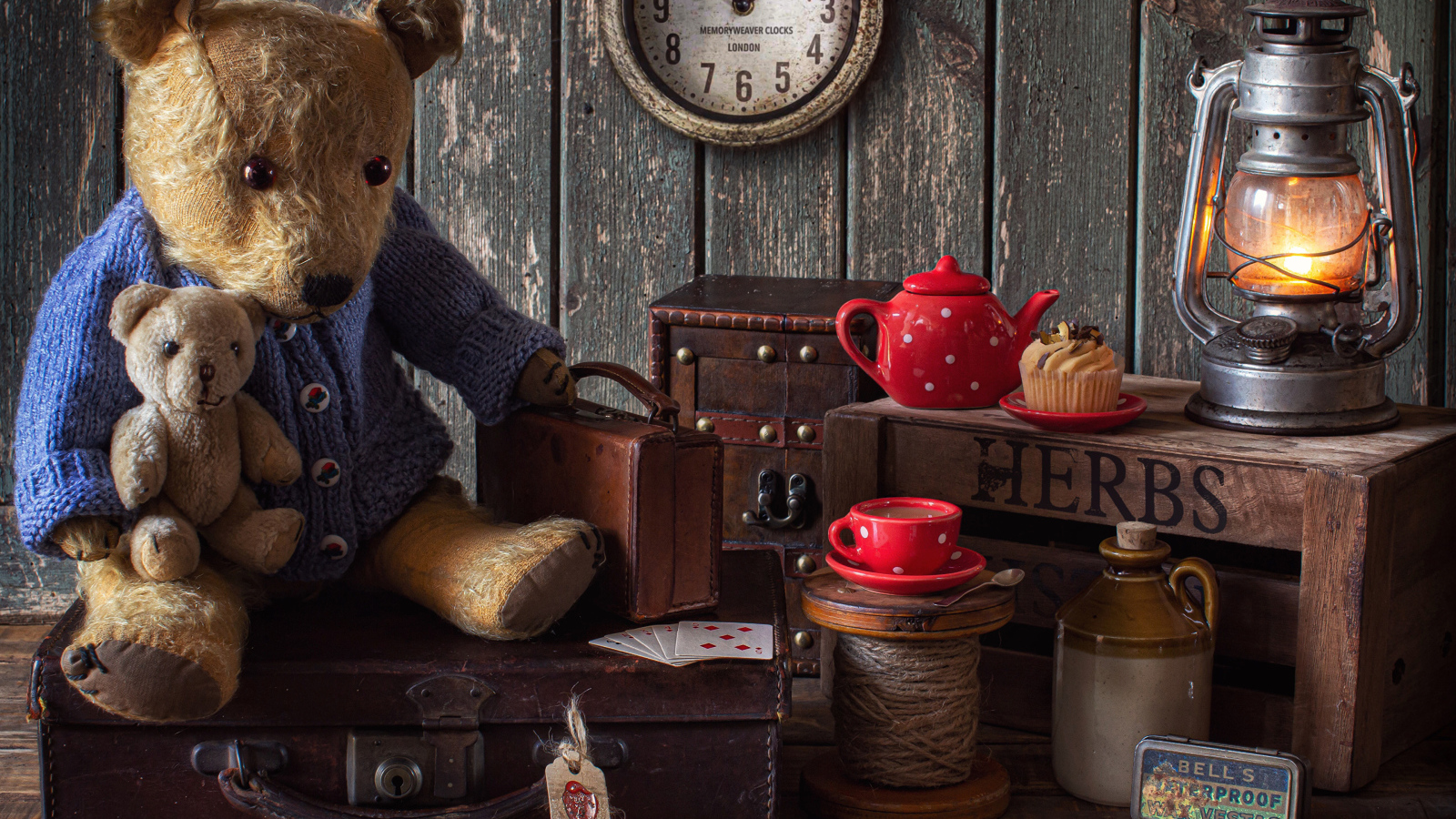 Old teddy bear with toys on the table
