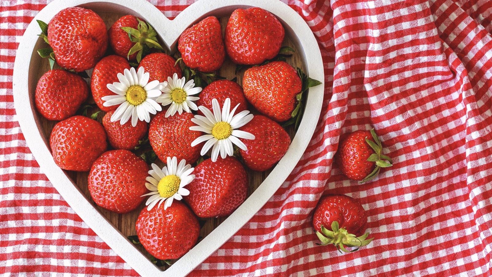 Heart shaped wooden box with strawberries and daisies