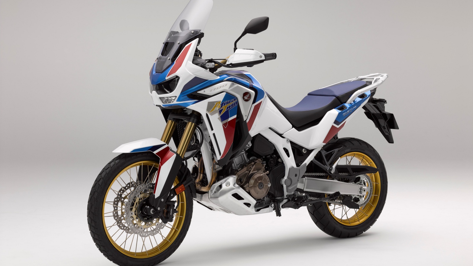 Спортивный мотоцикл Honda  CRF 1000 D, 2020  года на сером фоне