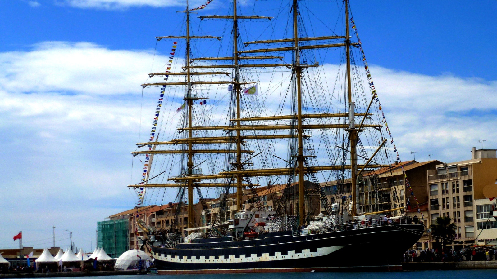Large sailing frigate in the port against the sky