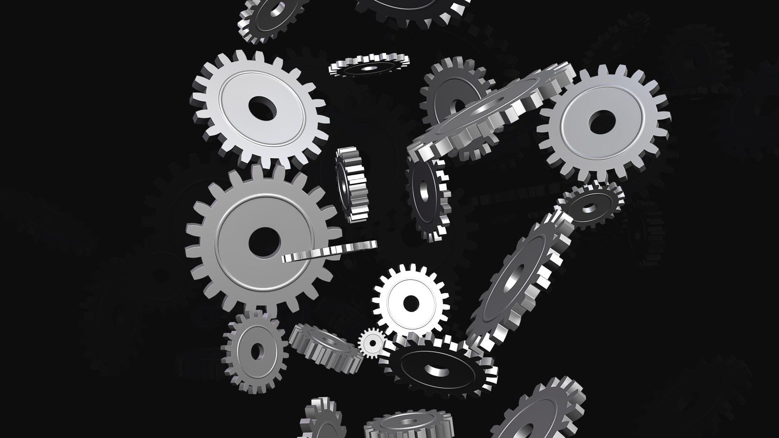 Металлические шестеренки в воздухе на черном фоне