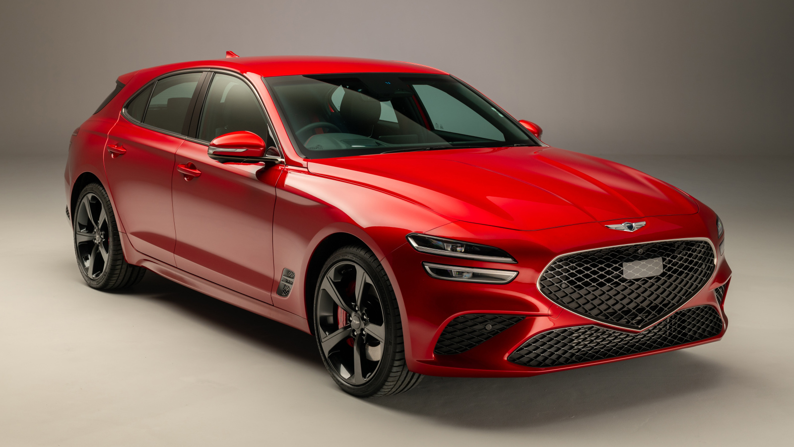 Красный Genesis G70 2.0T Shooting Brake 2021 года на сером фоне