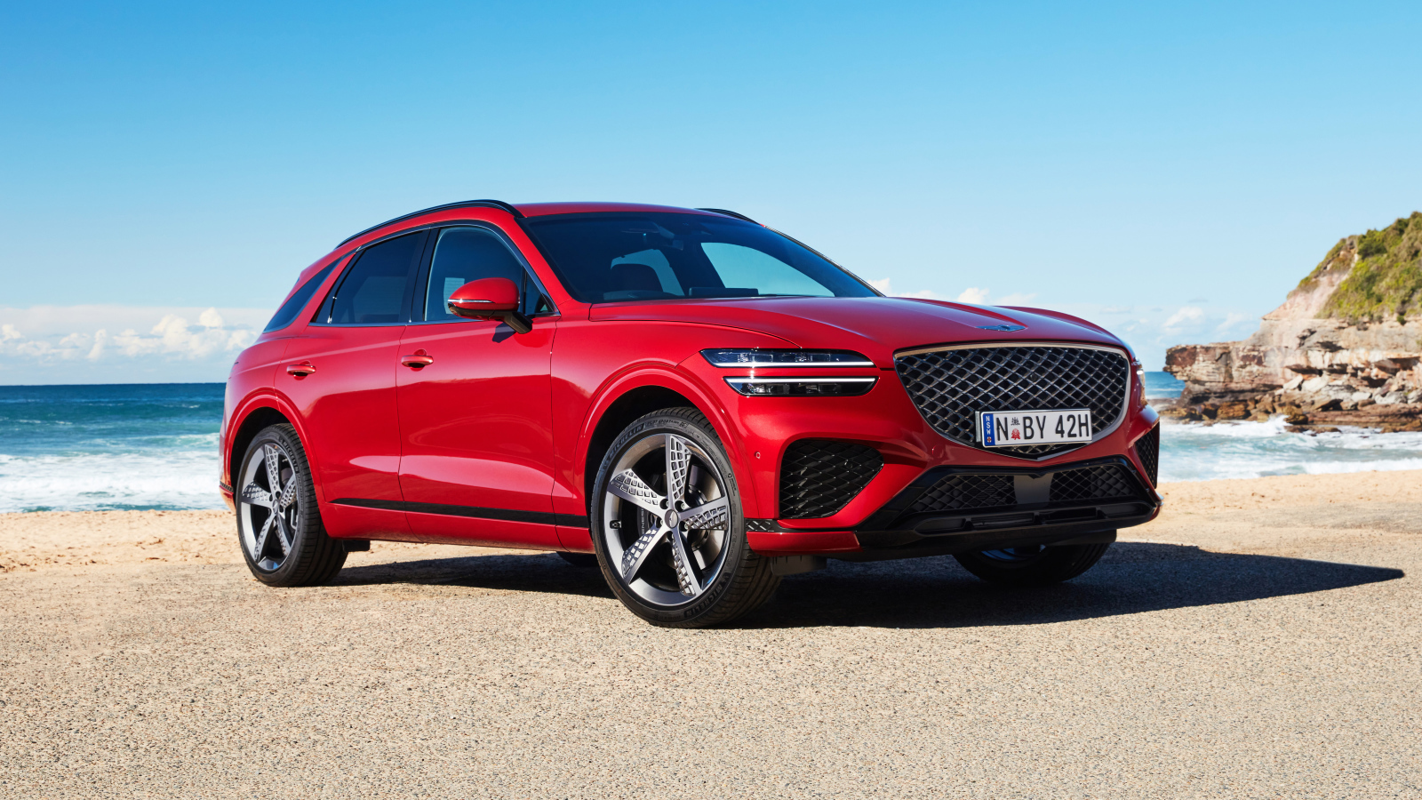 Красный внедорожник Genesis GV70 2.5T AWD 2021 года у моря