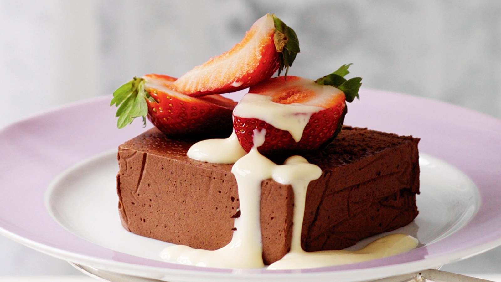 Chocolate soufflé with strawberries on a plate