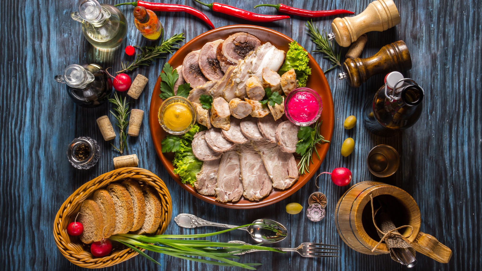 Appetizing cold cuts on the table with spices and bread