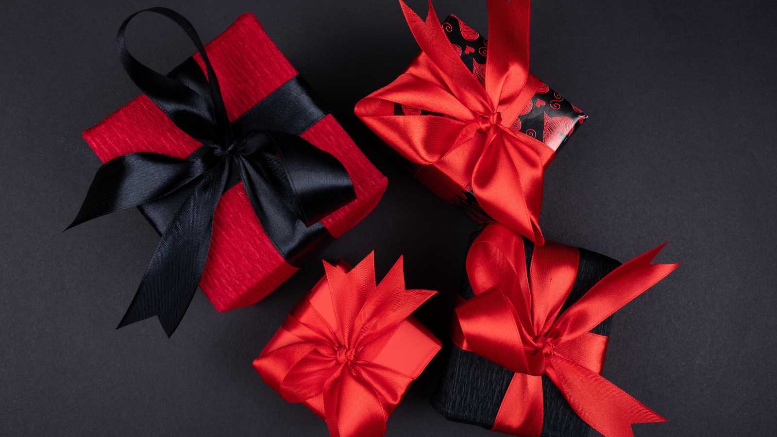 Bright boxes with gifts on a black background