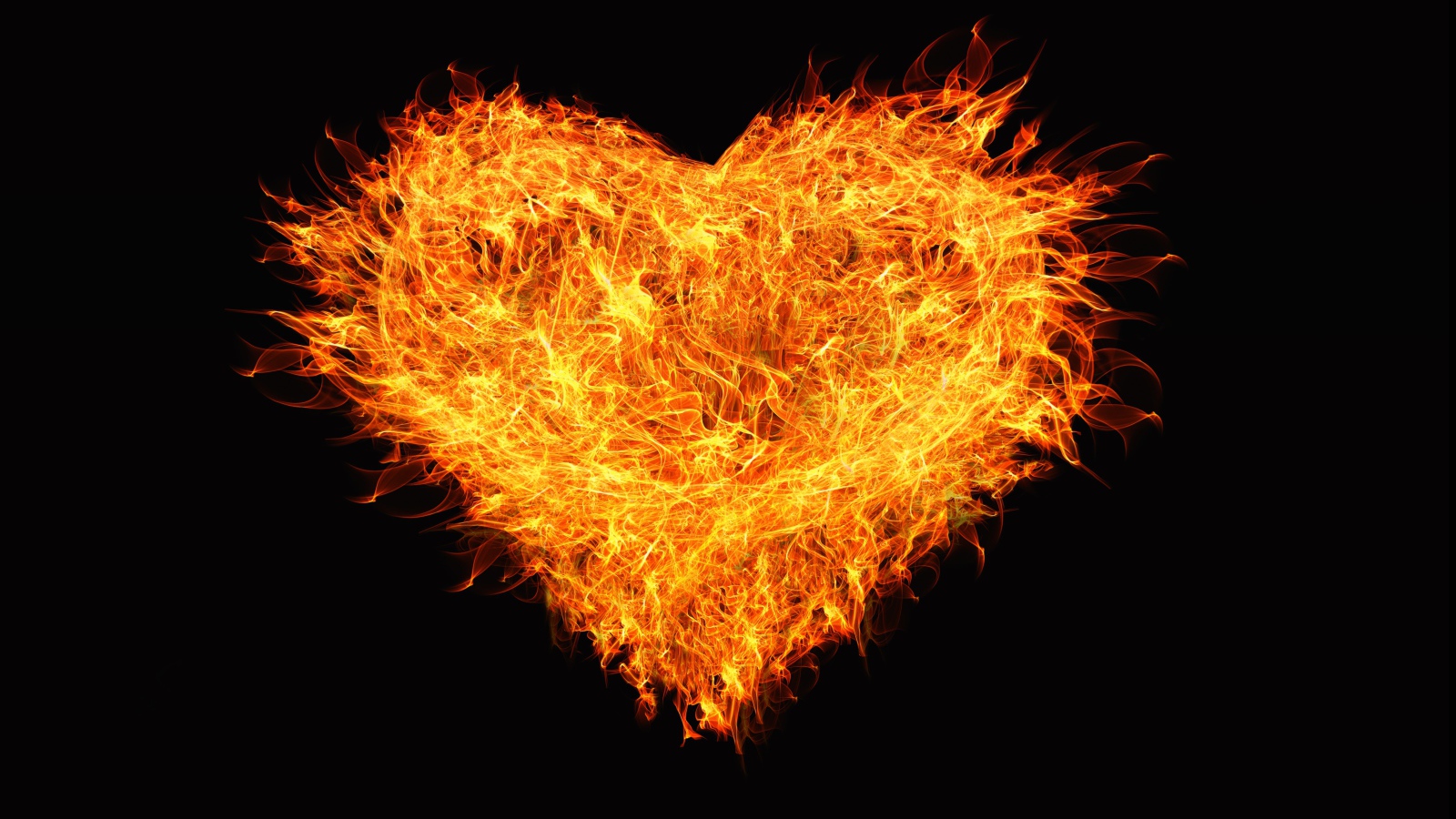 Big fiery heart on black background