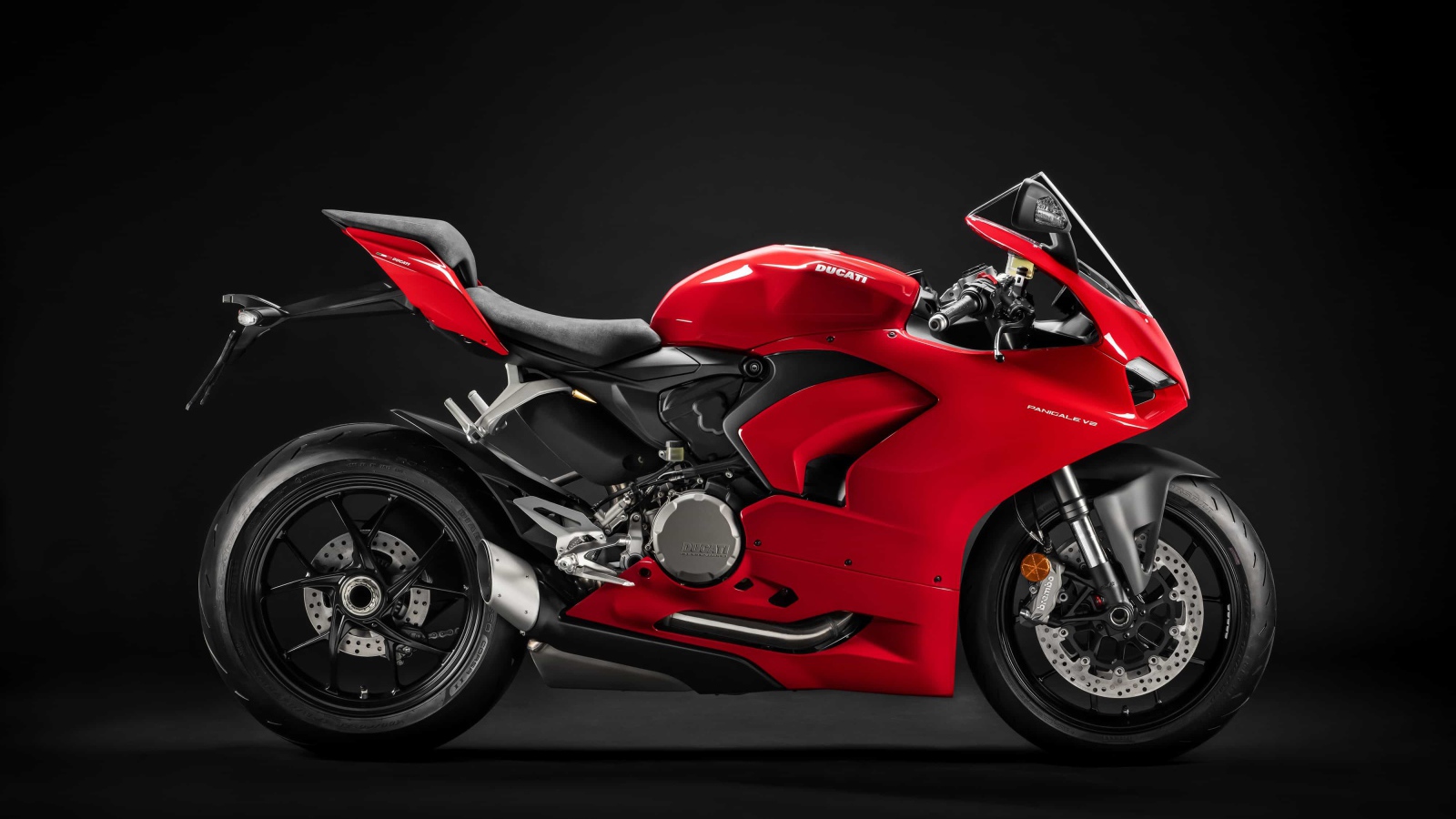 Red motorcycle Ducati Panigale v2, 2020 on a black background