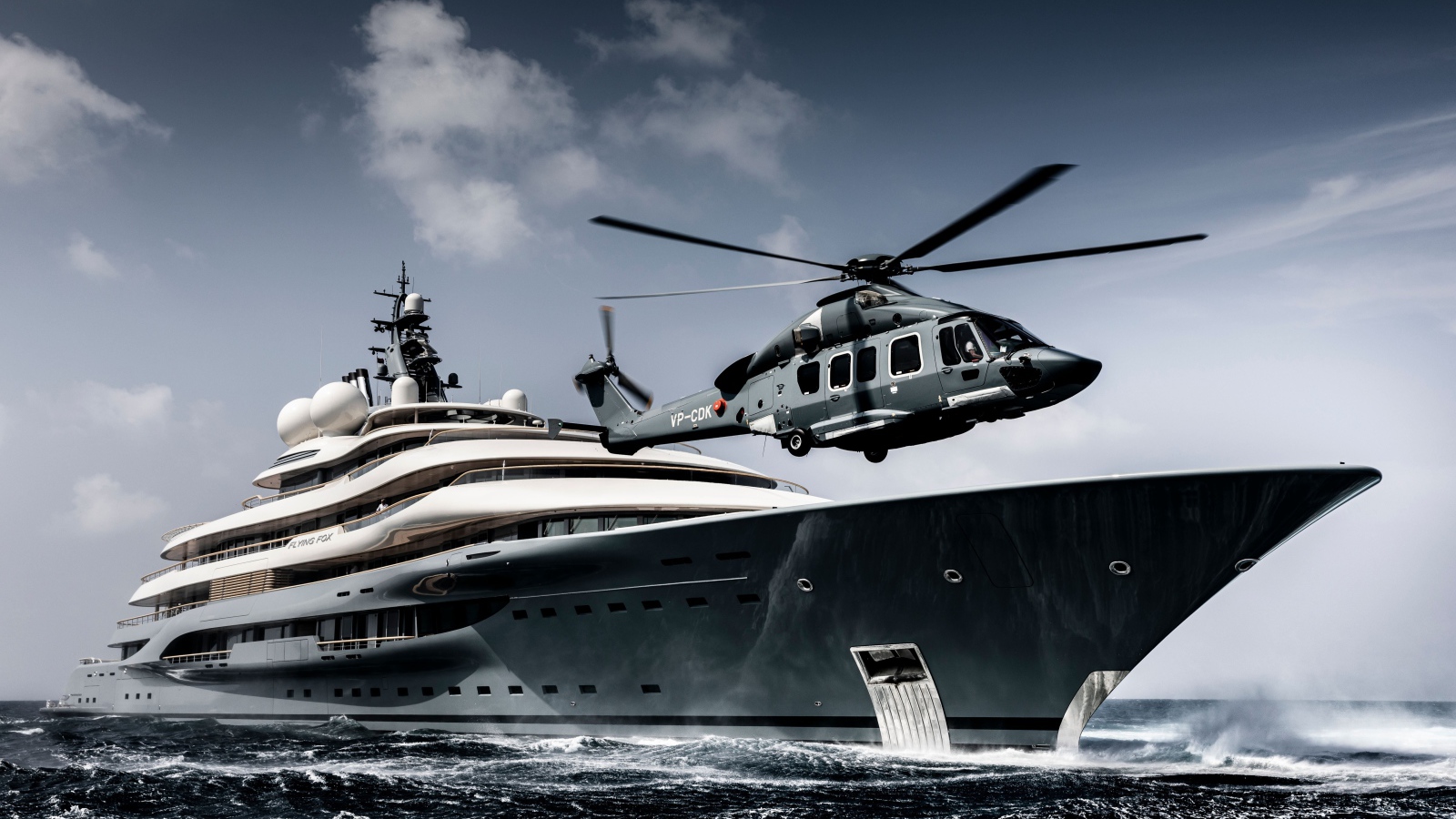 The helicopter lands on the yacht at sea