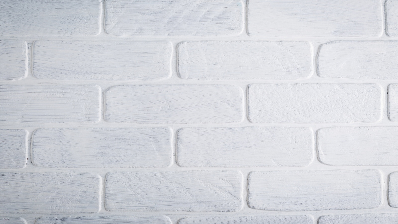 Белая кирпичная стена крупным планом