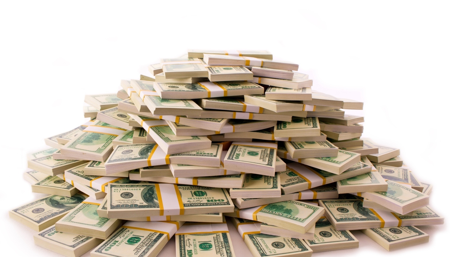 Гора пачек с долларами на белом фоне