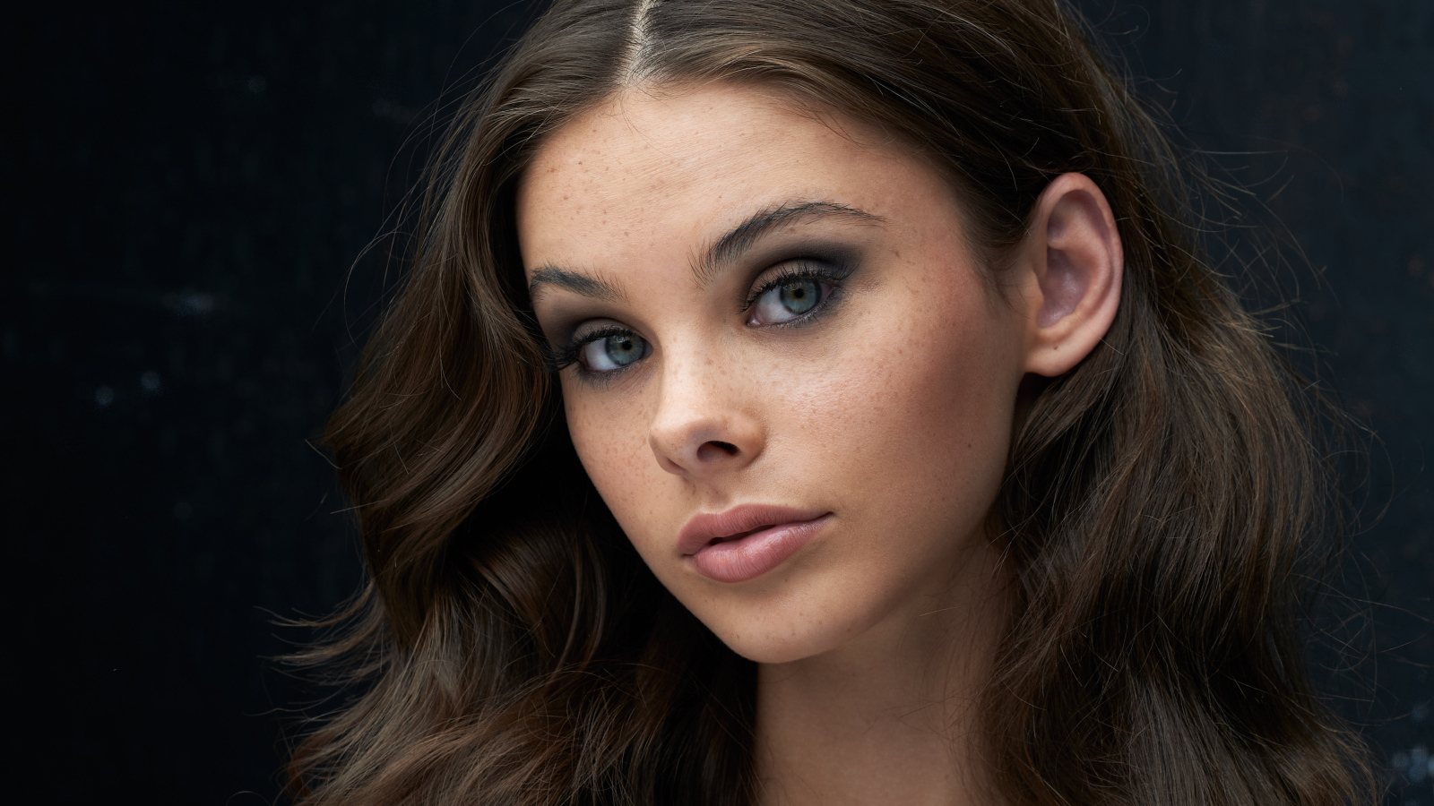 Cute brunette girl with gray eyes