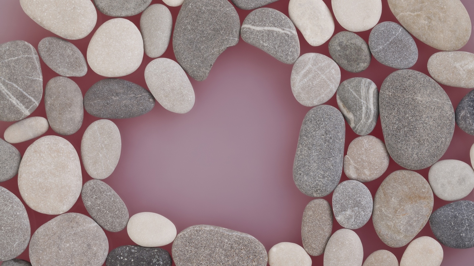 Много камней на розовом фоне
