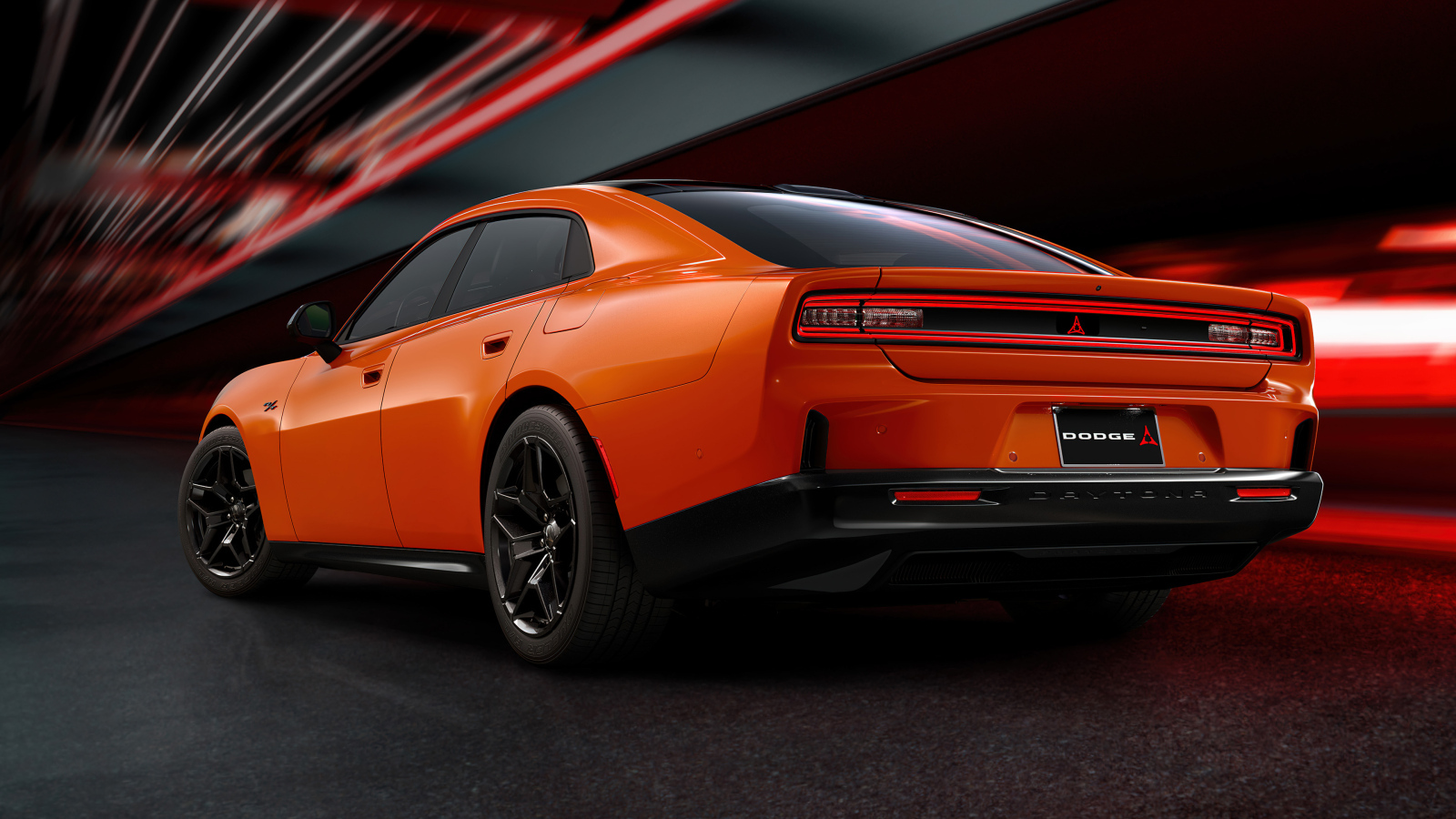 Вид сзади на новый оранжевый автомобиль Dodge Charger Daytona RT 2025 года