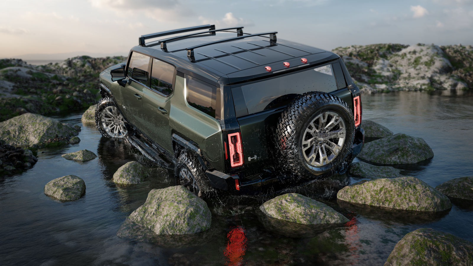 Внедорожник GMC Hummer EV Pickup 2024 года едет по камням