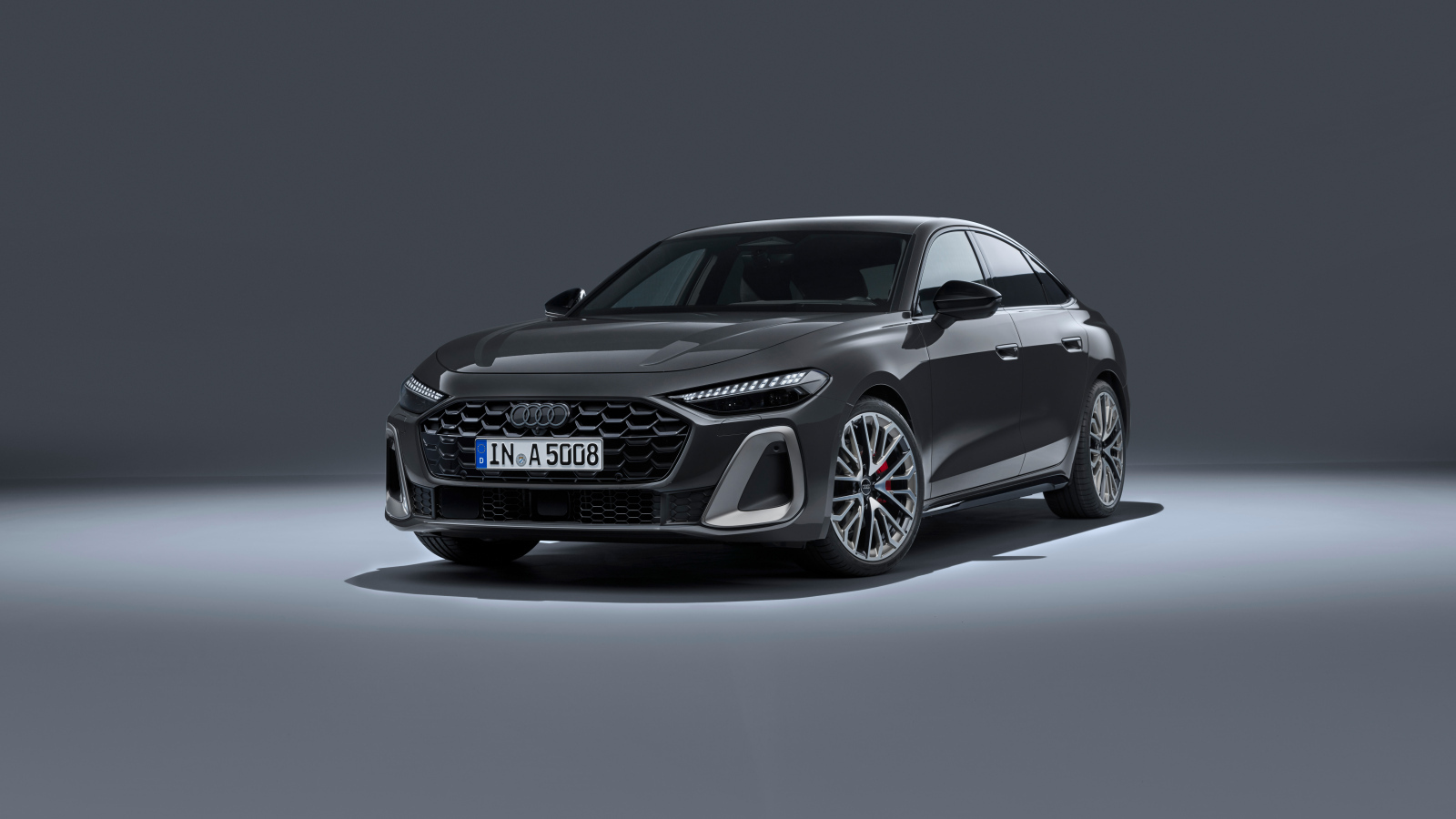 Автомобиль Audi A5 TFSI quattro S line 2024 года на сером фоне