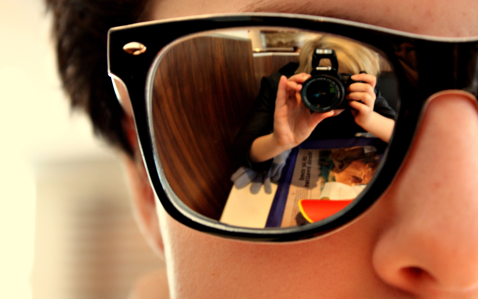 Reflection of a man with glasses