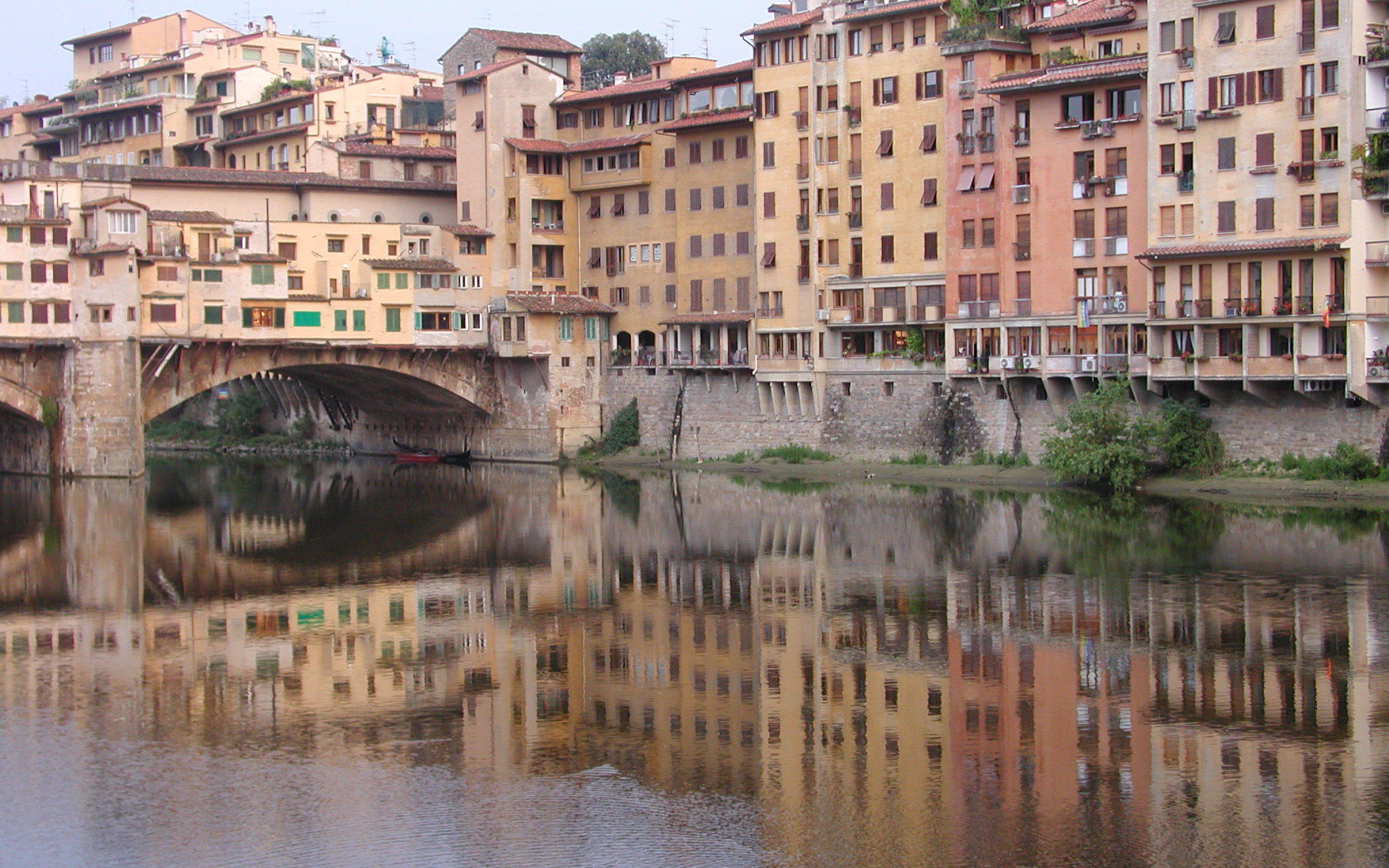 Reflection of buildings in water in Florence, Italy