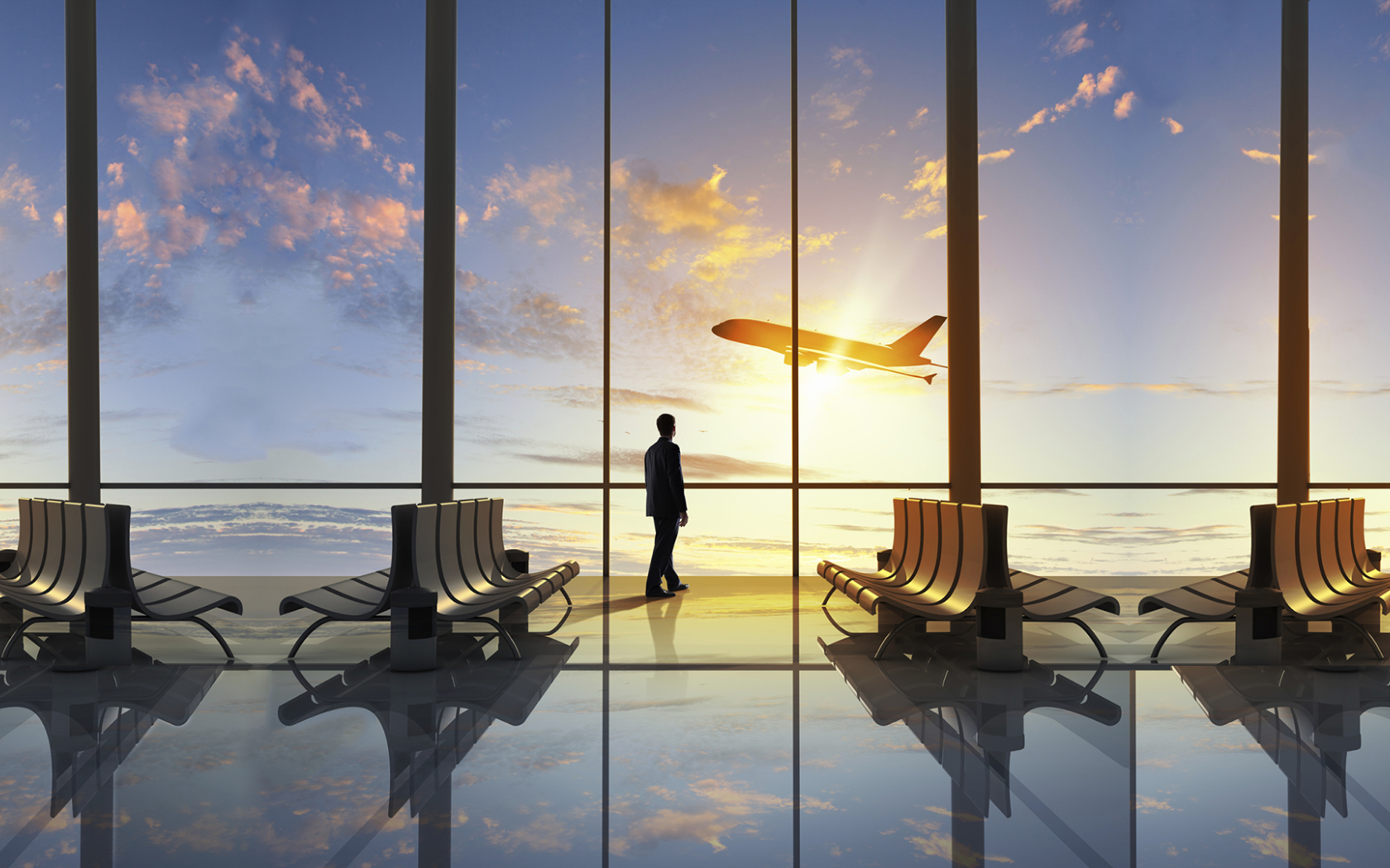 Мужчина смотрит в окно на взлетающий самолет