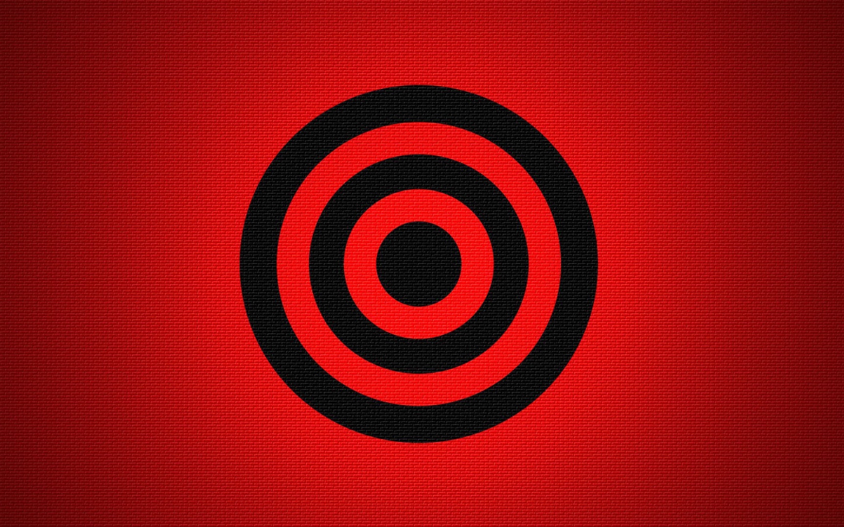 Черная мишень на красном фоне