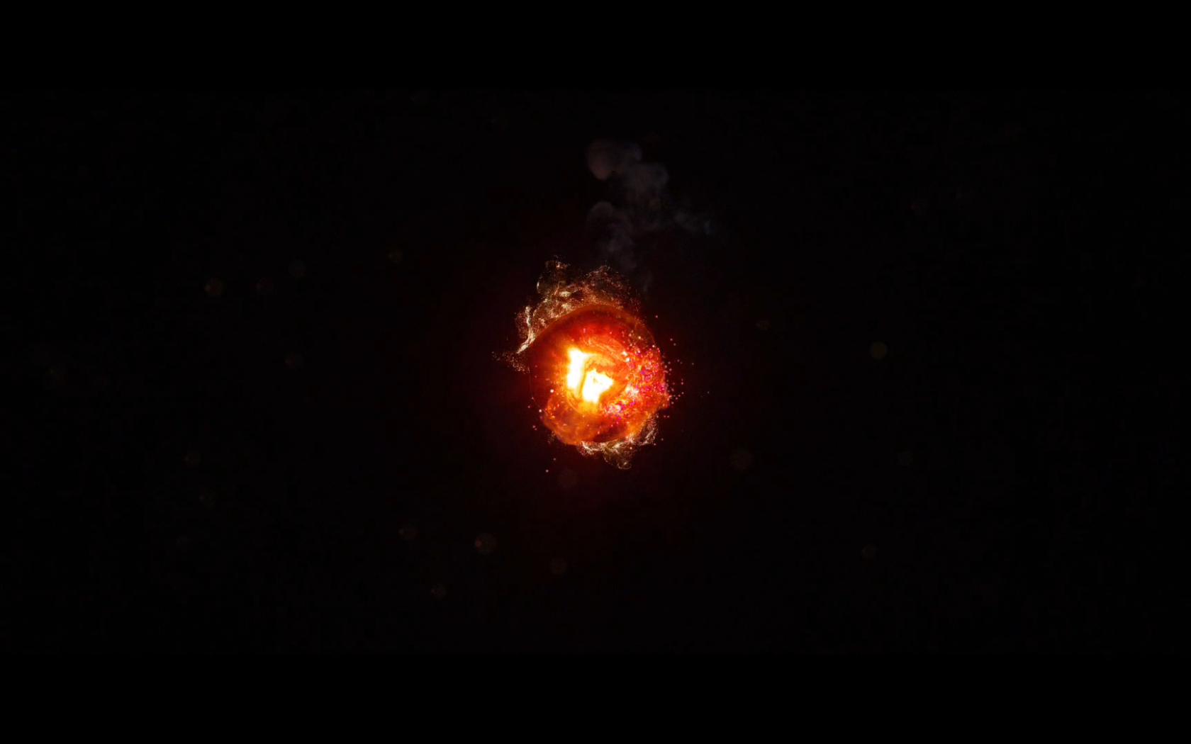 Горящий уголек, черный фон