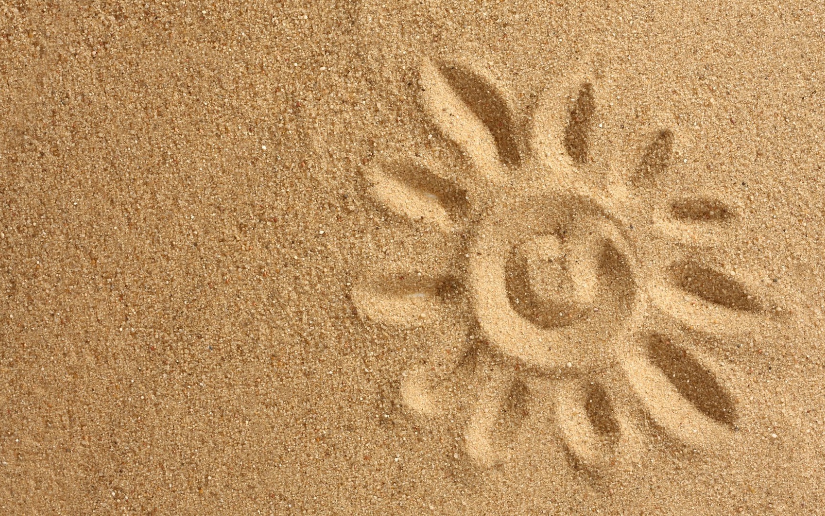 Рисунок солнца на песке