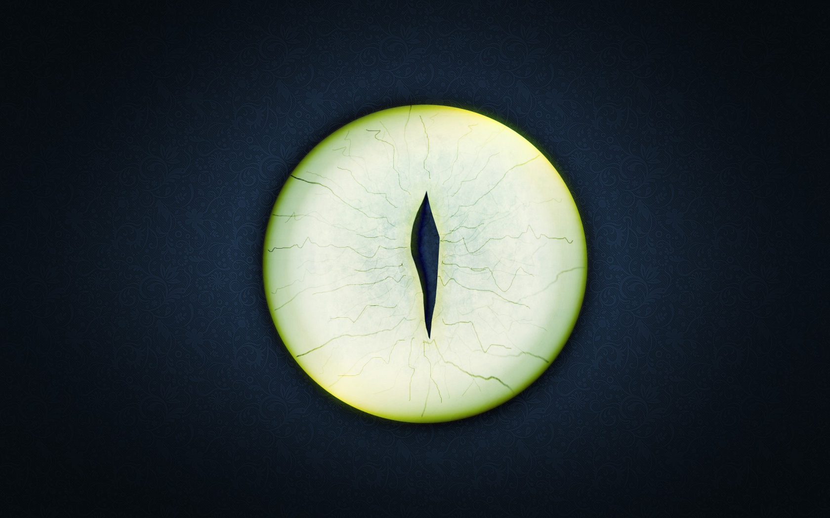 Круглый зеленый глаз на черном фоне