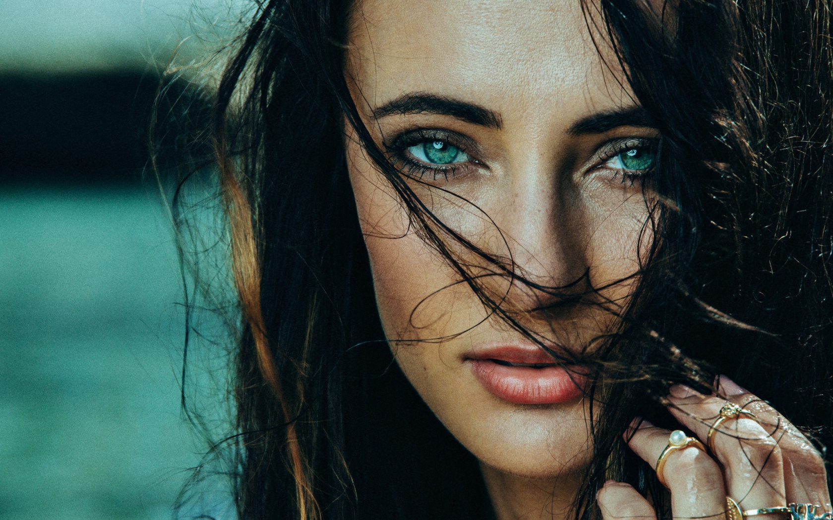 Green-eyed brunette with wet hair