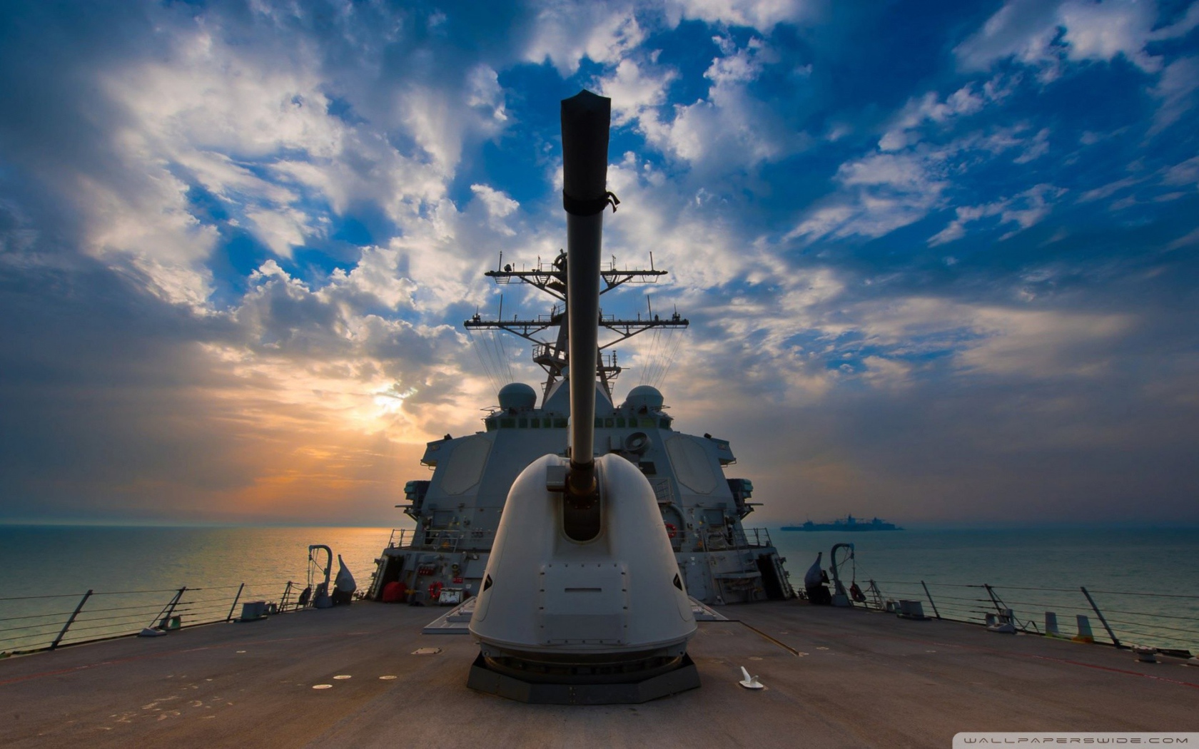 The cannon on the deck of a warship