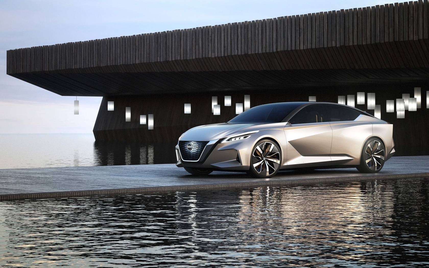 Серебристый автомобиль Nissan Vmotion 2.0 Concept, 2017 у воды 