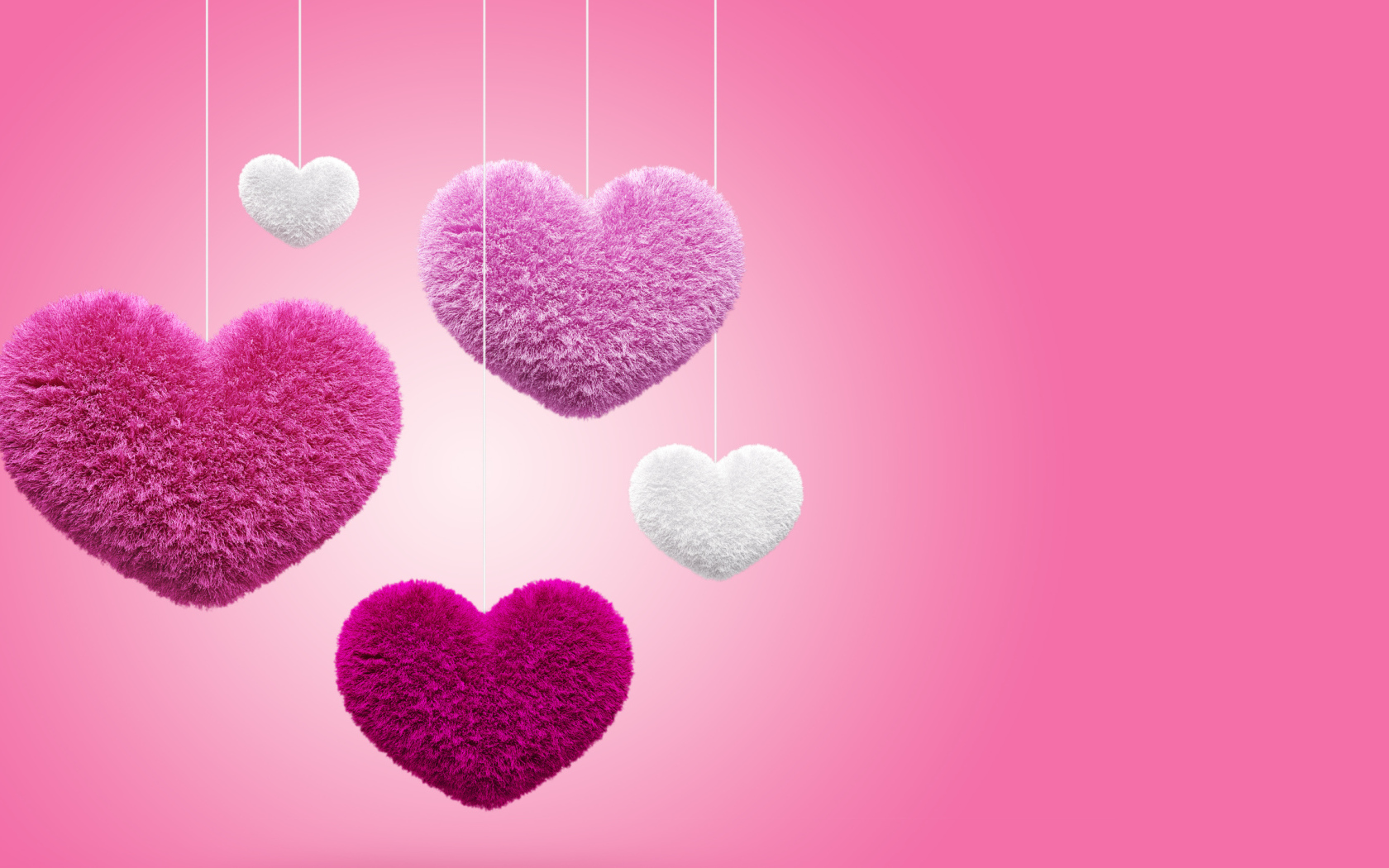 Мягкие пушистые сердечки на розовом фоне 