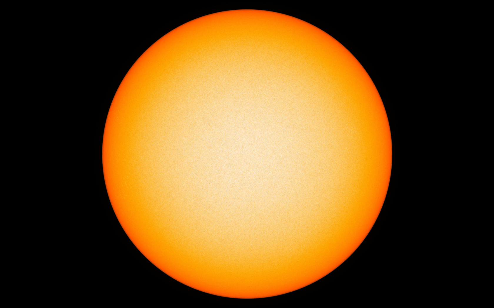 Яркое желтое солнце на черном фоне