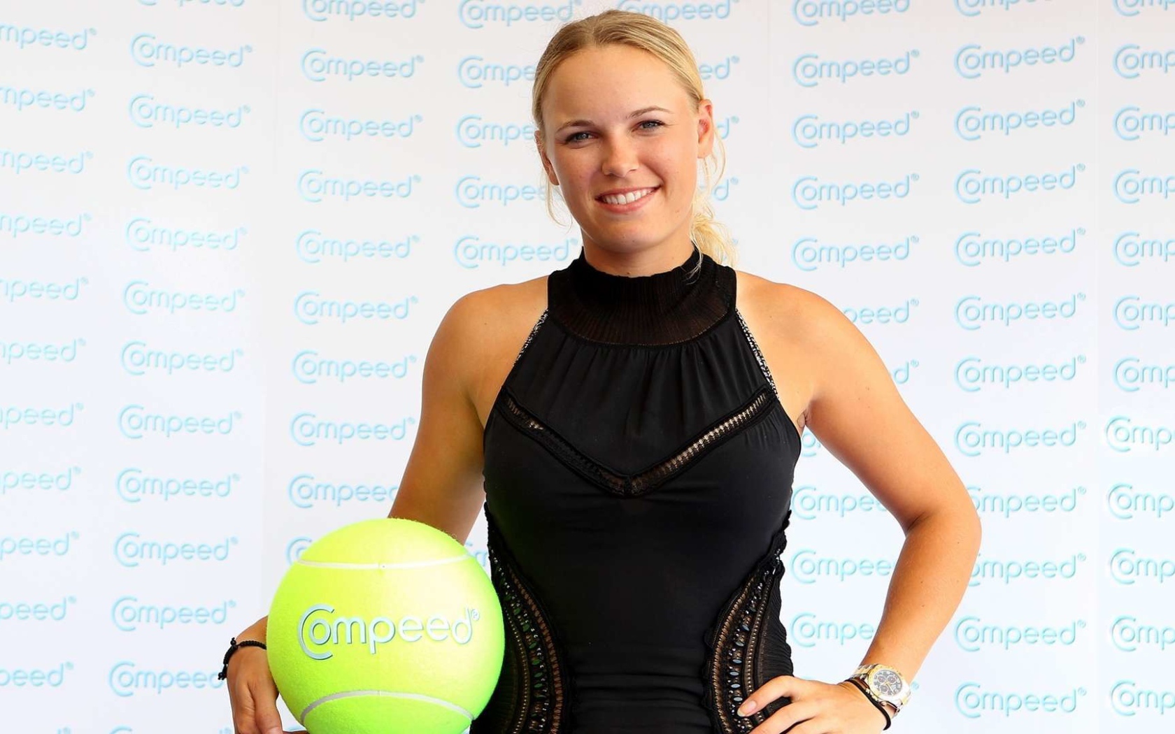 Tennis player Caroline Wozniacki in a black dress