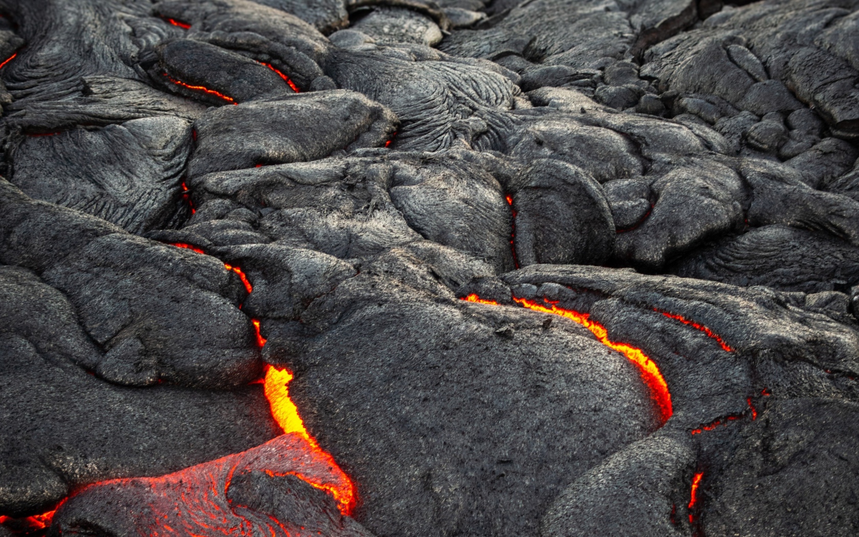 Lava makes its way through the cracks in the volcano