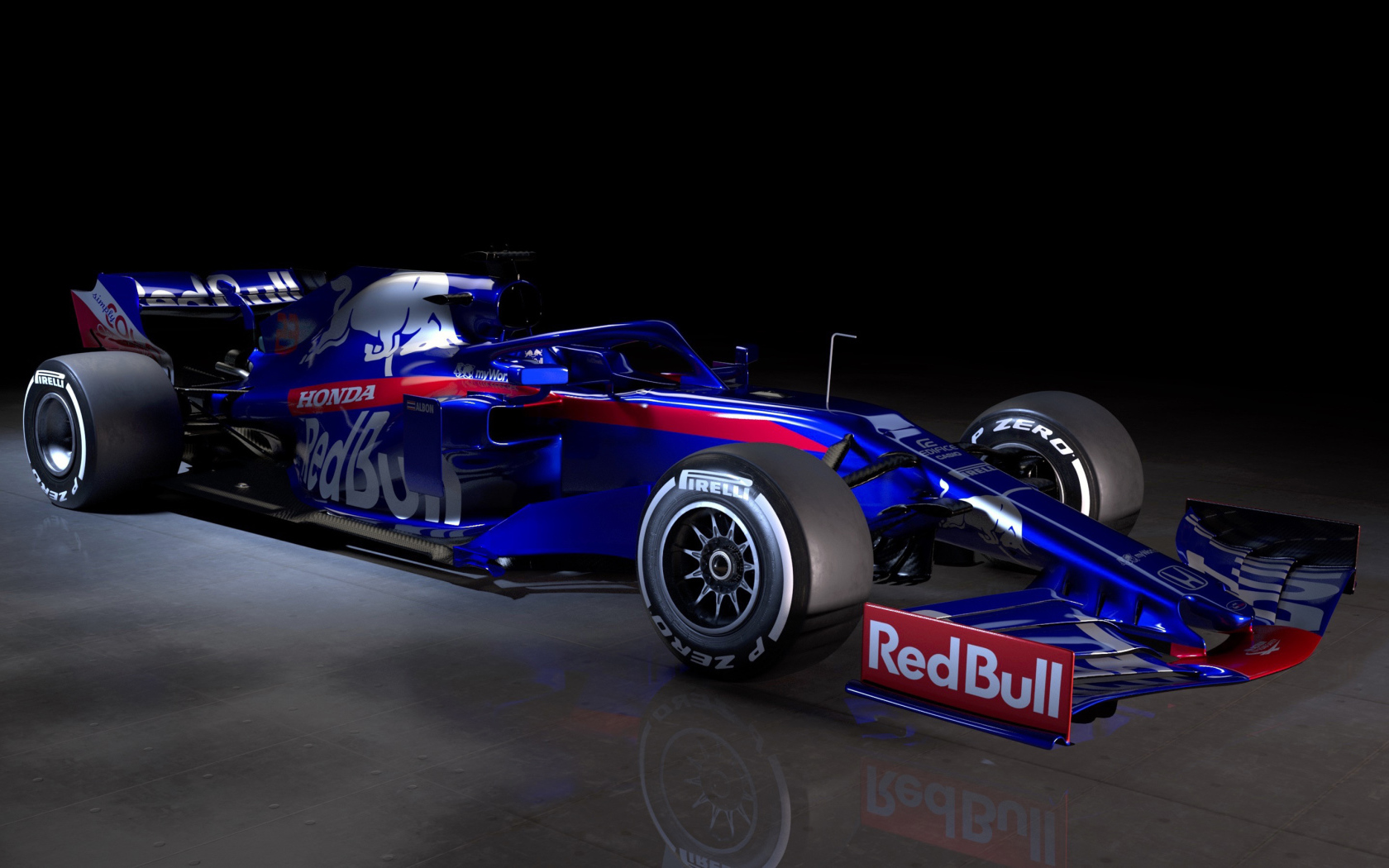 Синий гоночный автомобиль Toro Rosso STR14 2019 года на черном фоне