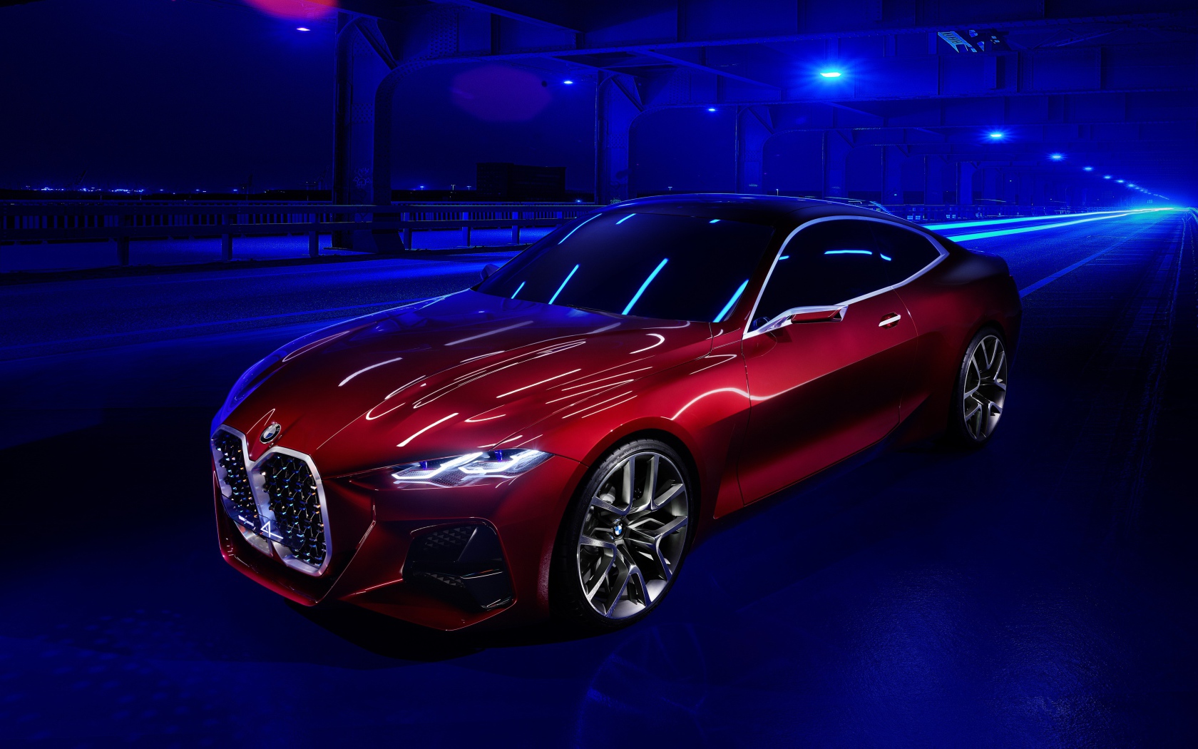 Красный автомобиль BMW Concept 4 2019 года в неоновом свете на мосту