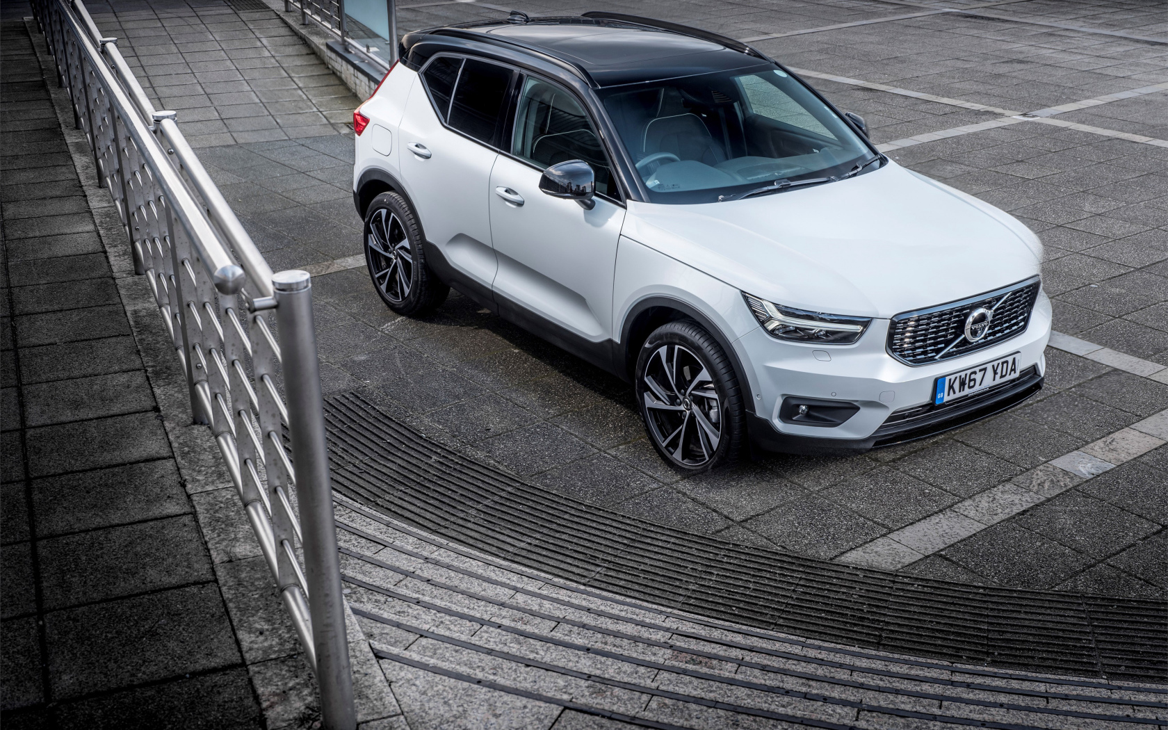 White Volvo V60 car at the stairs